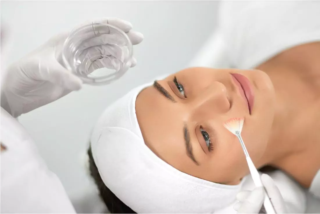 young woman doing chemical peel procedure scaled 1
